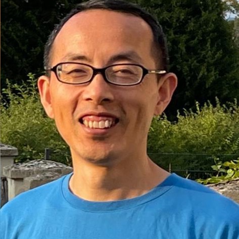 Qigong master with glasses smiling